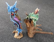 Resin figures of a dragon on branch and a iguana on branch