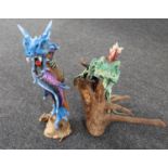 Resin figures of a dragon on branch and a iguana on branch