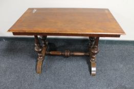 A continental walnut refectory coffee table