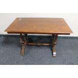 A continental walnut refectory coffee table