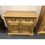 An Oak Furniture Land two drawer side cabinet,