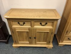 An Oak Furniture Land two drawer side cabinet,