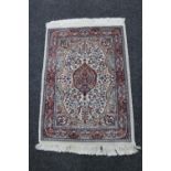 A Persian hearth rug,