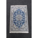 A Persian hearth rug,