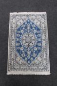 A Persian hearth rug,