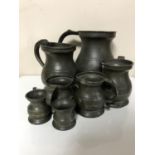 A set of seven antique pewter tankards