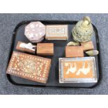 A tray of Eastern trinket boxes, brass bell,