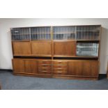 A pair of mid 20th century Danish sliding door display cabinets fitted cupboards and drawers