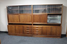 A pair of mid 20th century Danish sliding door display cabinets fitted cupboards and drawers