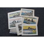 A file containing a quantity of unframed pictures, monochrome signed etchings,