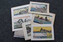 A file containing a quantity of unframed pictures, monochrome signed etchings,