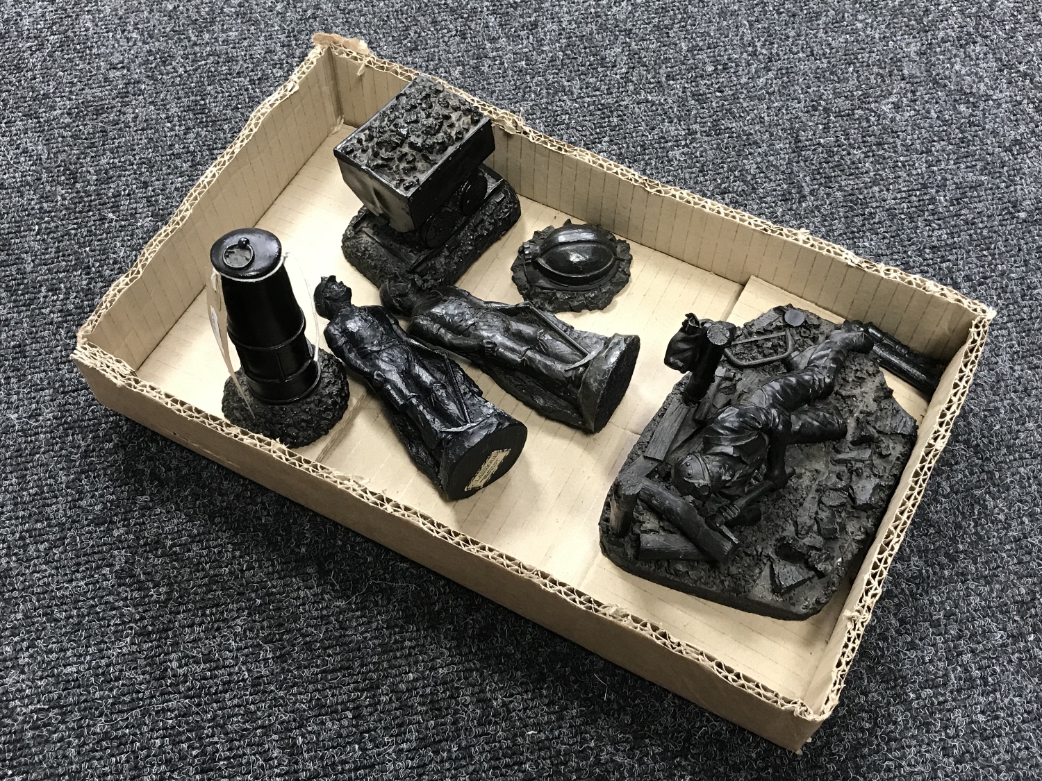 Six mining ornaments carved from coal