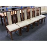 A set of fourteen sheesham wood cream leather upholstered dining chairs together with one other