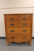 An Edwardian satinwood five drawer chest
