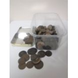 A plastic tub containing Georgian and Victorian pennies and half pennies,