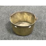 An antique brass jam pan