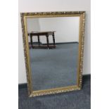 A gilt framed bevelled overmantel mirror