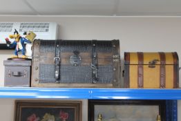 A leather storage box together with two further storage boxes in the form of trunks and a Warner