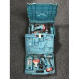 A cased Makita 14 volt twin drill set with battery and charger,