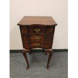 A 19th century walnut three drawer bedside chest on cabriole legs, width 38 cm.