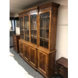 A good quality yew wood breakfront bookcase, width 204 cm,