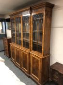 A good quality yew wood breakfront bookcase, width 204 cm,