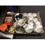 A box of a quantity of Ringtons tins, vases, teapots,