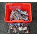A box containing seven bags of assorted costume jewellery