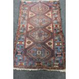 An antique Caucasian rug,