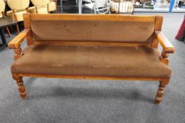 A wood framed pub settee