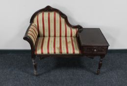 A mahogany effect telephone table in striped fabric