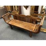 An Indonesian hardwood three seater bench,