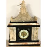 A 19th century slate mantel clock with brass and enamelled dial surmounted by a seated figure