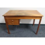 A mid 20th century teak desk fitted two drawers