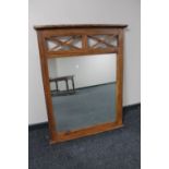 A sheesham wood overmantel mirror