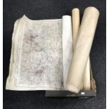A box of assorted 20th century rolled maps