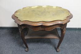 A continental oak shaped two tier serving table with lift out brass tray