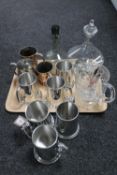 A tray of assorted plated and glass ware, two antique copper tankards, pewter tankards,