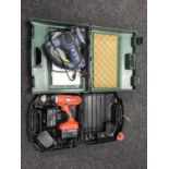 A cased Black and Decker 14 volt drill and a Powercraft saw in case