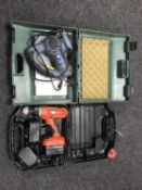 A cased Black and Decker 14 volt drill and a Powercraft saw in case