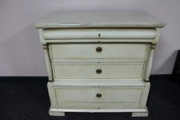 An antique painted pine four drawer chest
