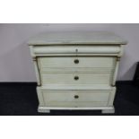 An antique painted pine four drawer chest