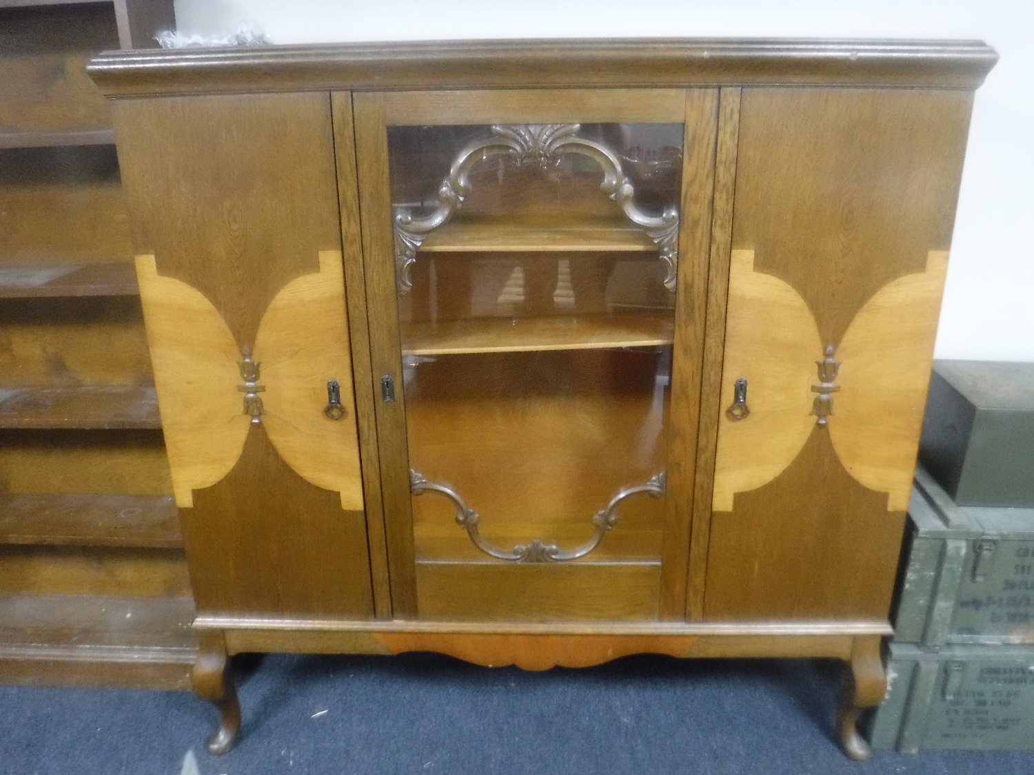 A continental glazed oak sideboard on cabriole legs