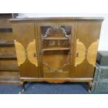 A continental glazed oak sideboard on cabriole legs