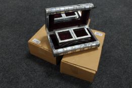 Two silvered trinket boxes in the form of books,