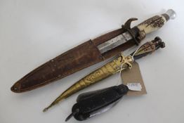 An antler handled knife in sheath,