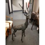 A cast patinated aluminium figure - stag and doe,