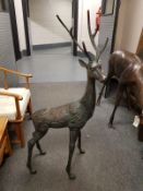 A cast patinated aluminium figure - stag and doe,