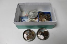 A box containing British pre-decimal and European coins,