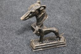 Two cast figures of greyhounds